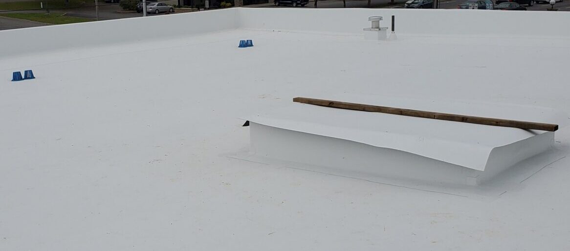 Flat roofing installation on a commercial building